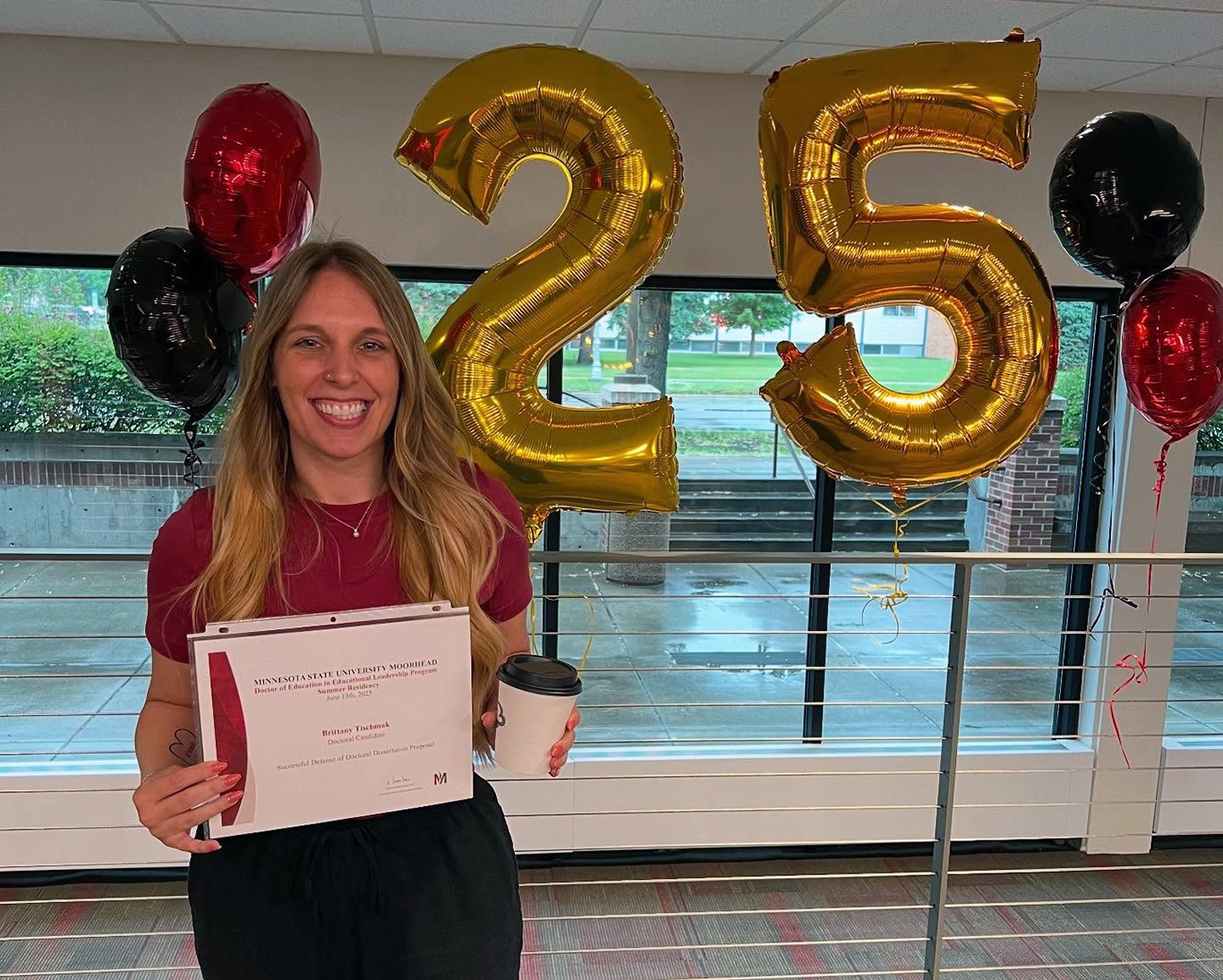 Brittany Tischmak with certificate