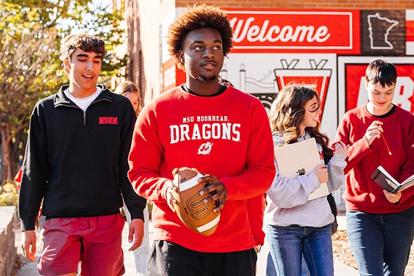 Student holding football
