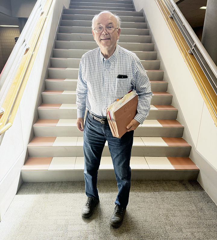 Mike Benson standing in front of the CB staircase