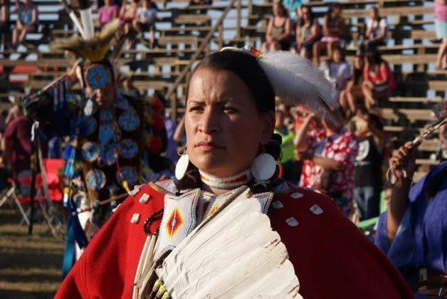 Delores wearing her regalia at a powwow.