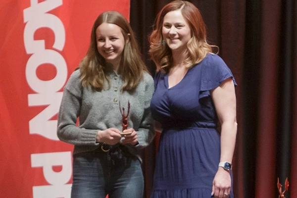 Student and advisor with Dragon Achievement Award