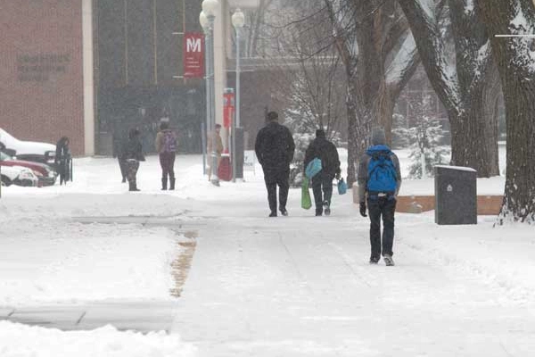Students walking to the student union on a snowy day