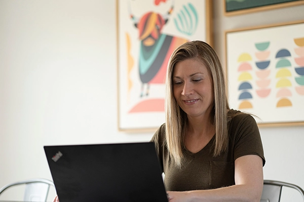 Graduate nursing student studying on laptop